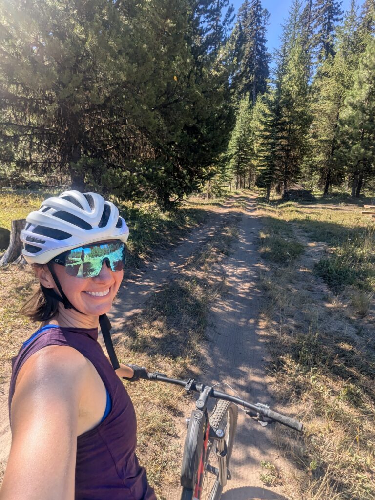 Woman on mountain bike in forest