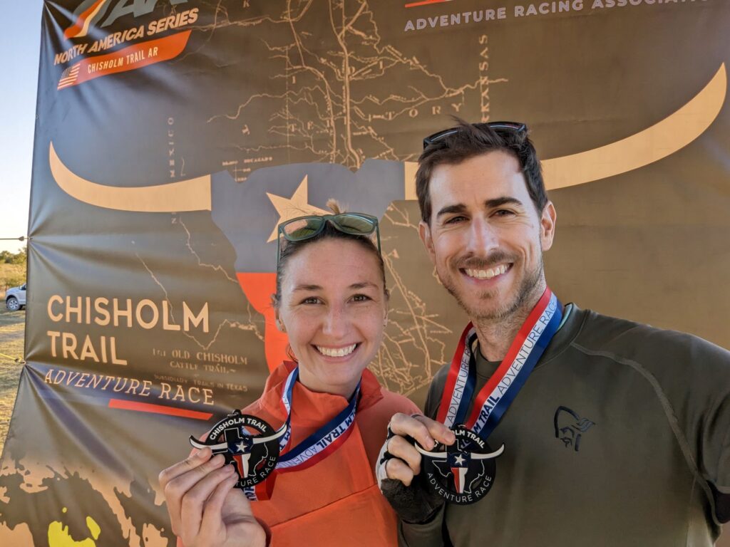 Adventure racers with medals